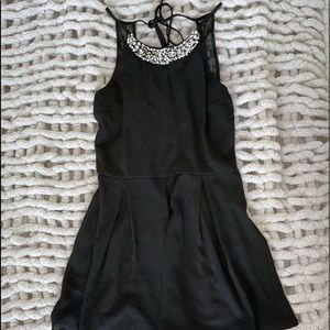 Black pleated romper with neck line details